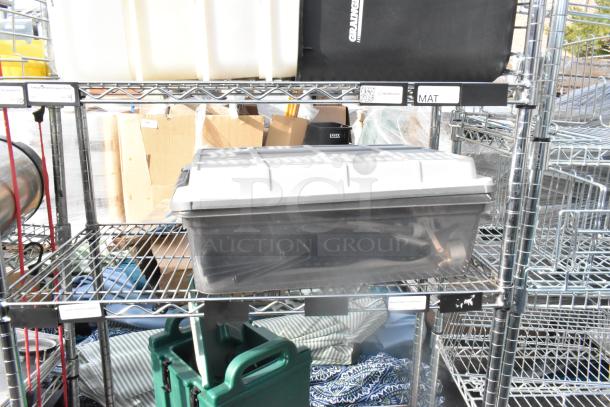 Chrome 5-tier wire shelving unit with contents, visible poly beverage holder. Buyer must dismantle.