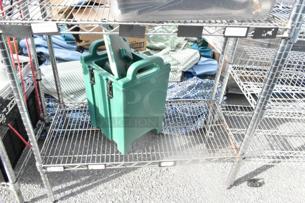 Chrome finish 5-tier wire shelving unit with poly beverage holder dispenser on lower shelf; buyer must dismantle.