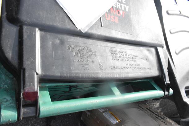 Two Husky poly trash cans with contents, visible branding and handling instructions on the lid, signs of use.