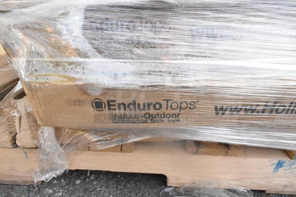 21 new scratch and dent items, featuring Holland Bar Stool 32" white faux marble table. Box labeled "EnduroTops" for tables.