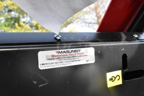 Magliner motorized hand truck label, model MHT75CB, 1,000 lb capacity, serial MHT01063. Made in USA, scratch and dent condition.