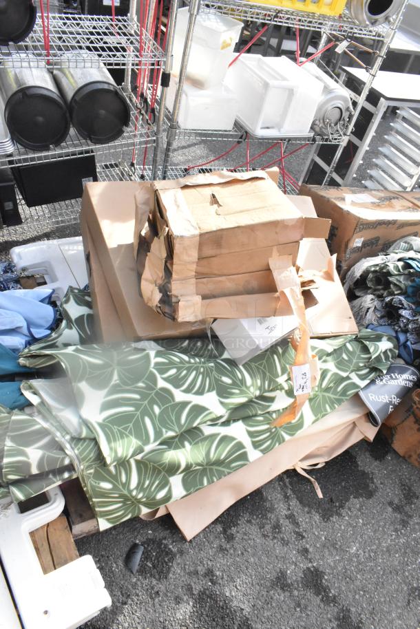 Assorted items including SK-12P convex mirrors, BRDUAL-V foil inflator, and fabric with leaf pattern. Some items in boxes.