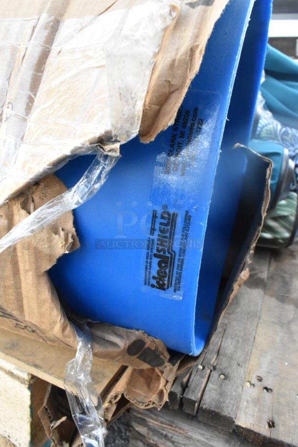 12 items including patio umbrellas, boxed. Features blue Kegshield containers, some packaging wear. 12 times your bid.