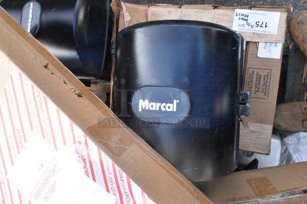 Marcal Poly wall mount paper towel dispensers, new in box, featuring black finish. Includes 24 items total per auction bid.