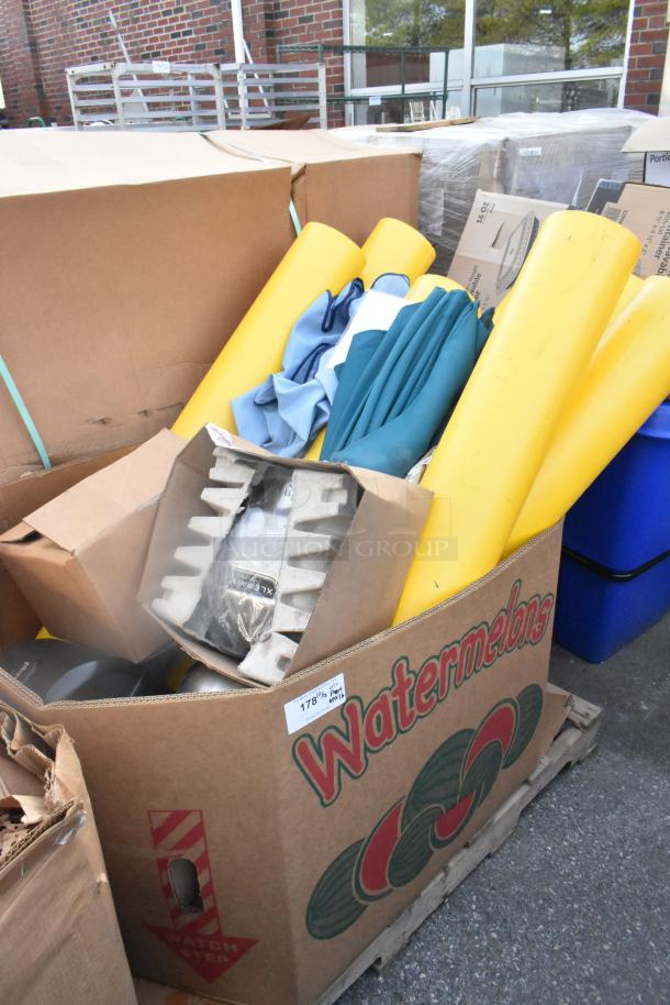 Box containing Xlerator hand dryer, yellow tubes, and various materials. Appears in good condition with visible packaging.