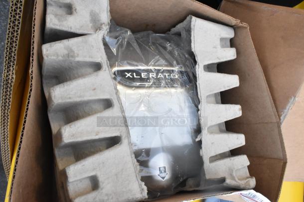 Xlerator hand dryer in box with protective packaging, visible brand logo. Part of a lot of 16 various items for auction.