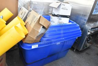 Blue Lavex tilt truck with carton boxes labeled "Choice Portion Cup" and yellow tubes; scratch and dent condition.