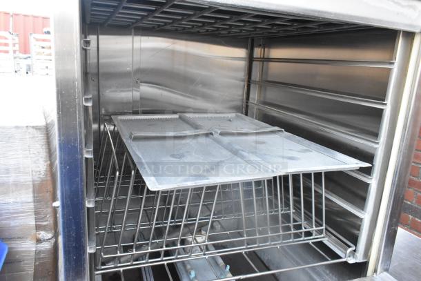 LVO FL14E stainless steel commercial pot and pan washer, front load, 460V, 3 phase, interior view showing racks.