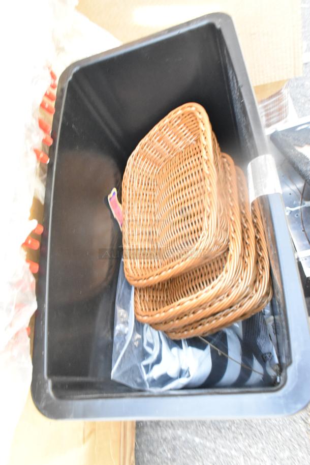 Brand new Lavex 23-gallon black slim trash can, scratch and dent condition, shown with wicker trays inside.