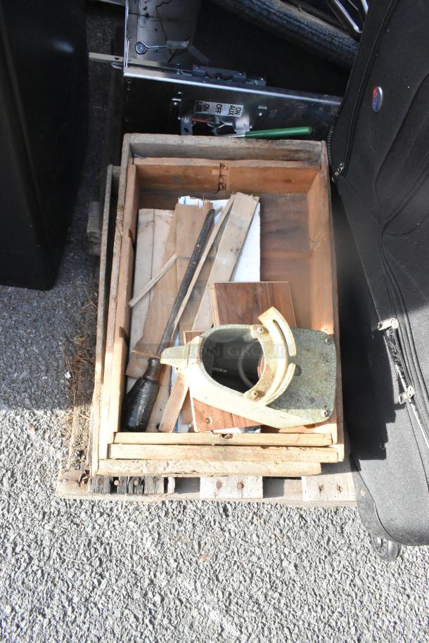 Various woodworking tools in a weathered wooden box, suggesting bulk auction lot condition and potential use.