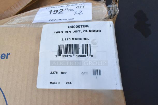 New San Jamar R4000TBK Twin Classic Double Roll Jumbo Toilet Tissue Dispenser. Scratch and dent. Model details visible.