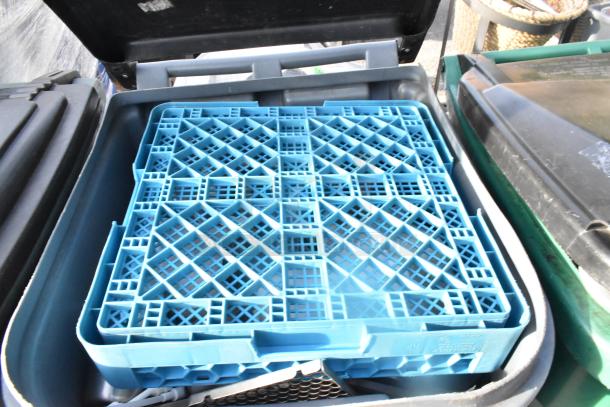 Two poly trash cans with open lids and blue lattice trays inside, showing good condition and practical use for waste management.