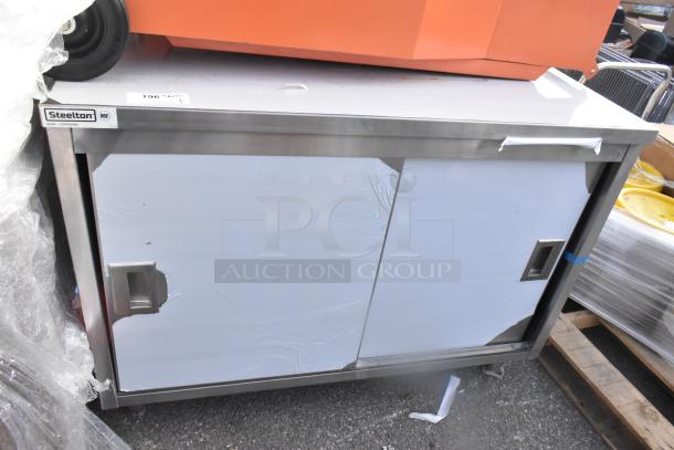 Brand new Steelton 522EBTB3048D 30"x48" stainless steel table with sliding doors, midshelf, 6" backsplash, scratched door.