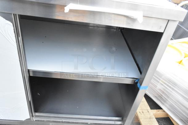 Steelton 522EBTB3048D 30" x 48" stainless steel table, enclosed base, sliding doors, midshelf, 6" backsplash, new condition.