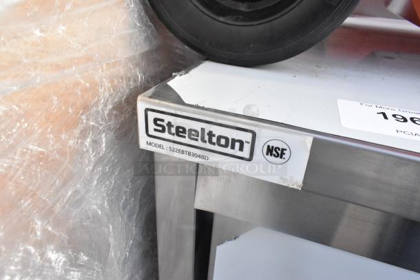 BRAND NEW Steelton 522EBTB3048D 30"x48" stainless steel table, 18-gauge, enclosed base, sliding doors, midshelf, 6" backsplash.