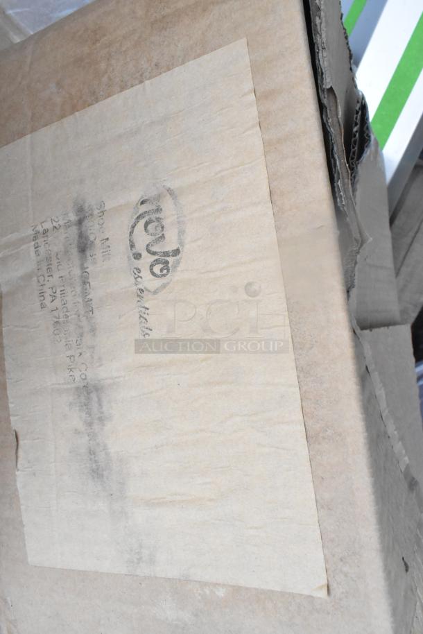 Cardboard box showing faded black ink stamp with some text. Box is slightly dented.