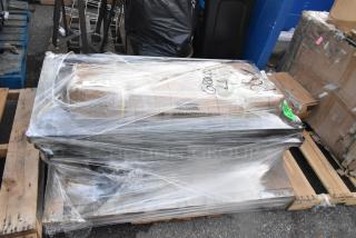 Auction items including Lancaster Table & Seating black 40" stanchion with 10' belt, and a shelf for 22 wine bottles, wrapped on a pallet.