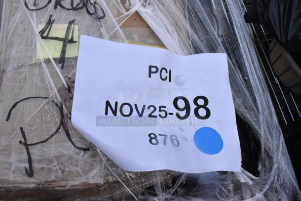 Plastic-wrapped pallet with various new items, including Lancaster Table & Seating stanchion and epoxy shelf. Label reads "PCI NOV25-98 876."