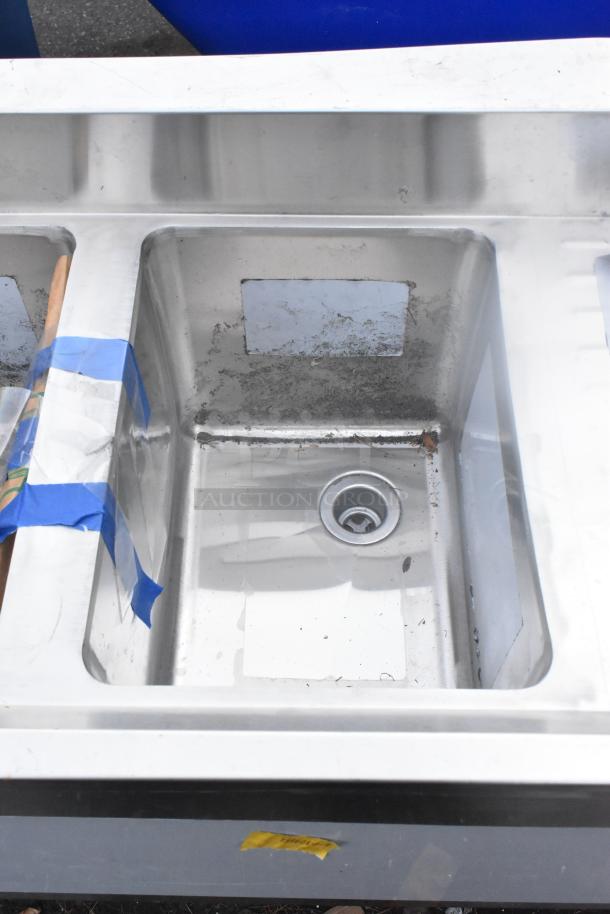 Brand new Regency 600B31014213 underbar sink, 3 bowls, 2 drainboards, 60"x18.75", scratch and dent condition.