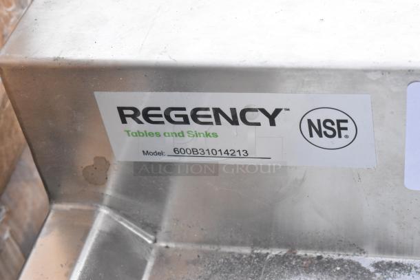 Three-bowl Regency underbar sink with two drainboards, model 600B31014213, brand new with scratch and dent; NSF certified.