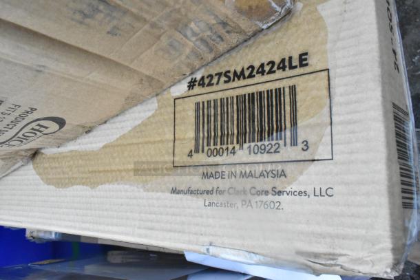 Cardboard packaging showing barcode and model #427SM2424LE, indicating a Lancaster Table & Seating Excalibur 24" x 24" table top.