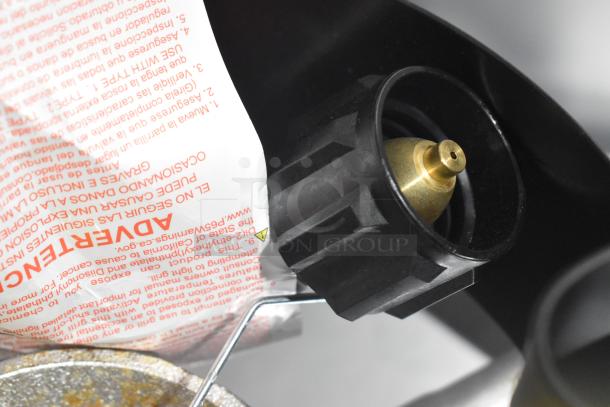 Black Metal Propane Gas Powered Stock Pot Range, features brass nozzle, safety labeling, excellent condition.