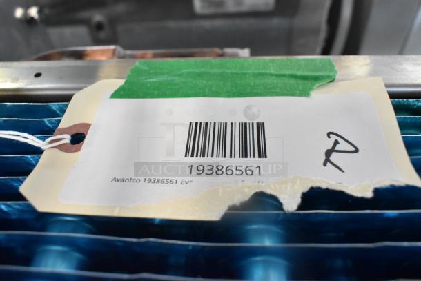 Brand new Avantco 19386561 evaporator coil with visible scratch and dent; compatible with VAC-28W and VAC-28B.