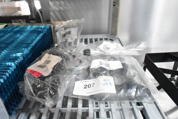 Four brand new sealed items in bags, including VacPak-It power cord, Avantco faucet and sight gauge, Hamilton Beach jar pad. Tags show item codes and auction details.