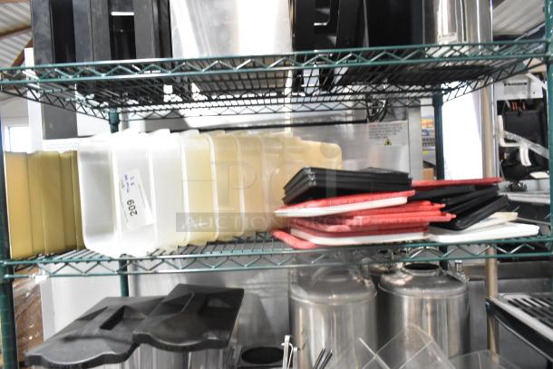 Two-tier metal shelf with assorted poly bins, lids, red and white trays, and stainless steel kegs. Label reads "209."