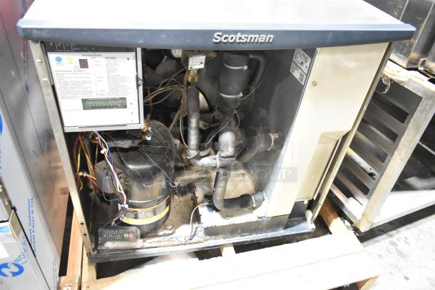 2017 Scotsman C1030MA-32D stainless steel commercial ice head, 208/230 volts, 1 phase, open side view showing internal components.