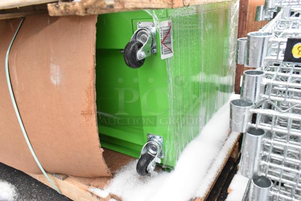 Brand new scratch and dent 3-compartment recycle bin, model 100635260, with casters, green finish, partially wrapped.