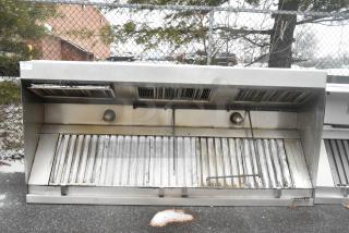 9.5' stainless steel commercial return air grease hood with filters and lights, shown outdoors. Moderate wear visible.
