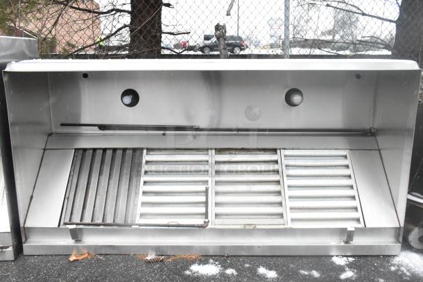 8' stainless steel commercial grease hood with filters and built-in lights. Features heavy-duty construction, ideal for kitchens.