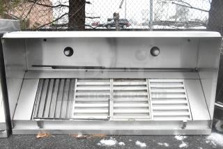 8' stainless steel commercial grease hood with filters and built-in lights. Features heavy-duty construction, ideal for kitchens.