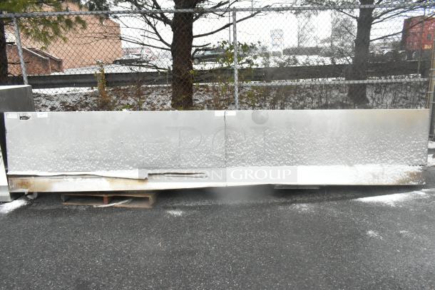 14.5' stainless steel commercial return air grease hood with filters and lights, snowy surface, outdoor setting.