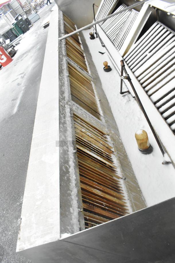 14.5' stainless steel commercial air grease hood with filters, lights; slight wear visible, suitable for restaurant use.