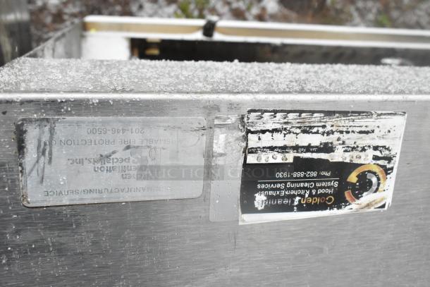 14.5' stainless steel grease hood with filters and lights; visible labels show manufacturer and cleaning services info.