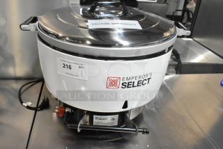 Brand new Emperor's Select EGRC140LP gas rice cooker, 140 cup capacity, 24,000 BTU. Features caution label for hot surface.