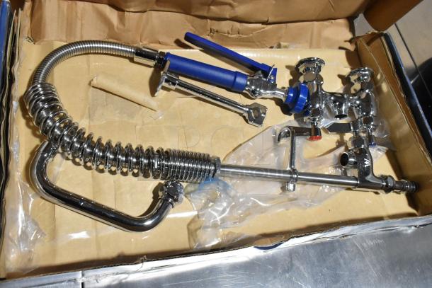 Brand new 750PRDL46 Waterloo pre-rinse faucet, 1.15 GPM, low profile, deck-mounted, 4" centers, 6" add-on faucet, visible scratches.