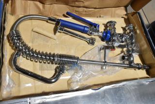 Brand new 750PRDL46 Waterloo pre-rinse faucet, 1.15 GPM, low profile, deck-mounted, 4" centers, 6" add-on faucet, visible scratches.