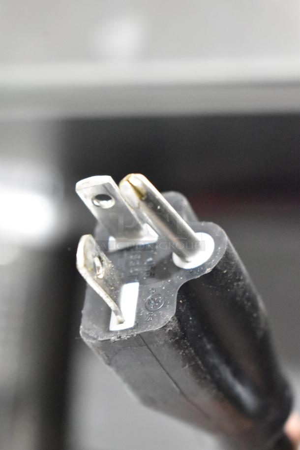 Close-up of a power plug for the Gaggia 21ACONCETTO Concetto Evo Duo espresso machine. 208 volts. New condition with some scratches.