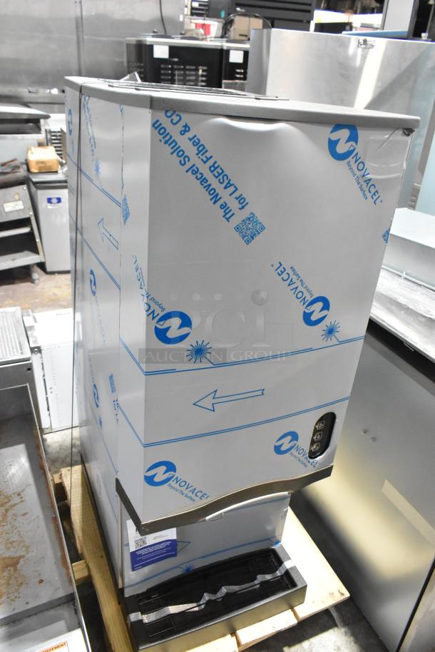 Manitowoc CNF0202A-161L stainless steel nugget ice maker, lever dispensing, minor scratches, protective film, 115V, new condition.