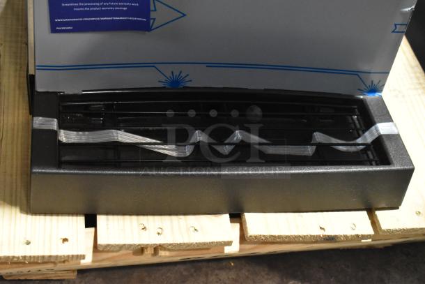 Brand new Manitowoc CNF0202A-161L stainless steel nugget ice maker/dispenser with a 20 lb. bin; lever dispensing.