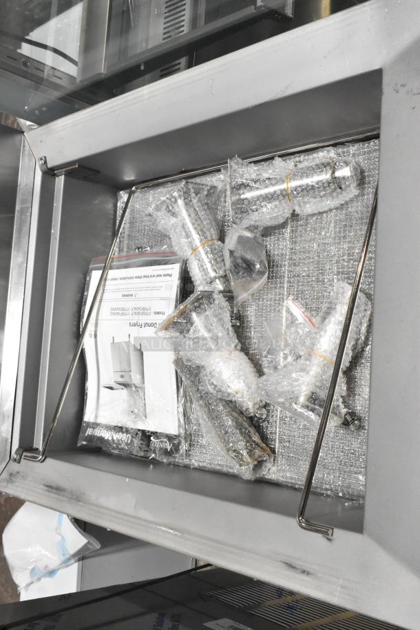 Brand new Avantco 177FBF1824LP stainless steel fryer, 125 lb capacity, propane gas, 90,000 BTU, with assembly parts.