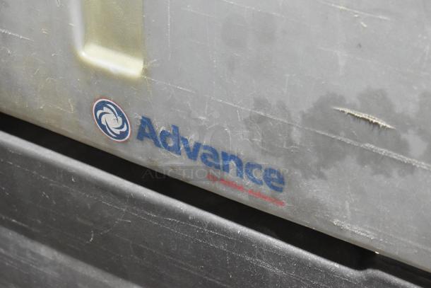 Nilfisk Advance floor cleaning machine, used condition, visible logo and markings, durable design.