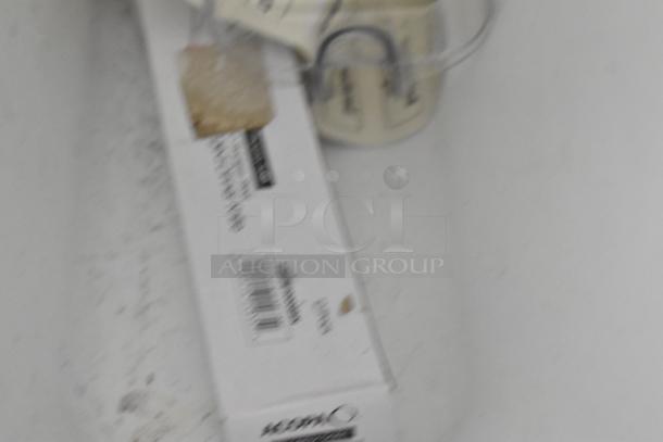 White poly ingredient bin with a lid and label holder. Slightly scuffed exterior suggesting light use. Ideal for kitchen storage.