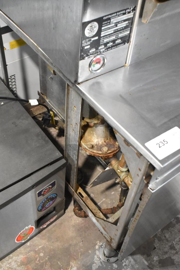 Cleveland PGM2002 stainless steel 2-deck pressure steamer, natural gas, 200,000 BTU, visible wear and rust, model info shown.