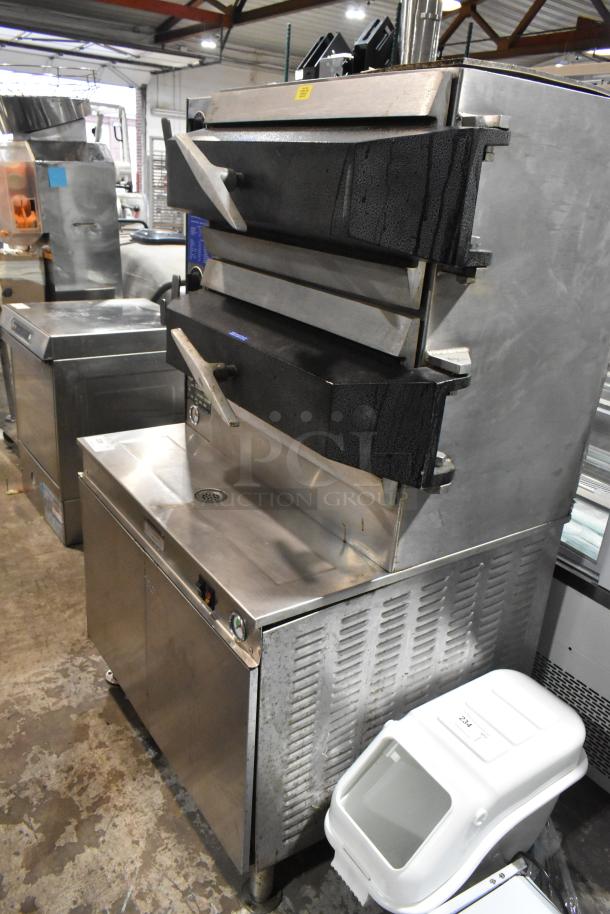 Cleveland PGM2002 stainless steel 2-deck pressure steamer, natural gas, 200,000 BTU, commercial use, well-maintained condition.