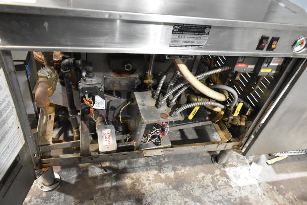 Cleveland PGM2002 stainless steel commercial gas steamer, 2 decks, 200,000 BTU, visible internal components, and labels.