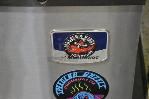 Manitowoc IY0304A-161 ice machine with stickers. Stainless steel, commercial half cube. 115V, 1 phase.